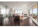 Bright living room with floor-to-ceiling windows, a fireplace, and stylish decor showcasing city views at 2881 Peachtree Ne Rd # 2304, Atlanta, GA 30305