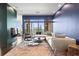 Bright living room featuring stylish furnishings, floor-to-ceiling windows, and captivating city views at 2881 Peachtree Ne Rd # 2304, Atlanta, GA 30305