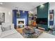 Contemporary living room boasts a cozy fireplace and a seamless view into the modern kitchen at 2881 Peachtree Ne Rd # 2304, Atlanta, GA 30305