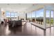 Open living space with a fireplace, access to a balcony, and expansive windows showcasing city views at 2881 Peachtree Ne Rd # 2304, Atlanta, GA 30305