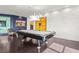 Games room with dark floors, accent lighting, a white brick wall and colourful artwork at 2881 Peachtree Ne Rd # 2304, Atlanta, GA 30305