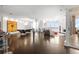 Open concept area with wood floors, exposed brick, large windows, and modern furniture at 2881 Peachtree Ne Rd # 2304, Atlanta, GA 30305