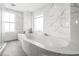 Bathroom features a modern glass walk-in shower with rainfall shower head at 2881 Peachtree Ne Rd # 2304, Atlanta, GA 30305