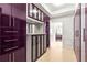 Custom walk-in closet with ample storage and stylish purple cabinetry at 2881 Peachtree Ne Rd # 2304, Atlanta, GA 30305