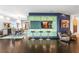 Stylish wet bar adjacent to the dining room, with bar stool seating and modern lighting at 2881 Peachtree Ne Rd # 2304, Atlanta, GA 30305