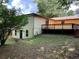 Backyard view showcasing the home's back exterior, deck, and surrounding greenery at 2981 Judylyn Dr, Decatur, GA 30033
