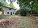 Exterior view of the backyard with house and deck at 2981 Judylyn Dr, Decatur, GA 30033