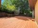 Backyard with wooden deck and well-maintained lawn, perfect for outdoor activities at 2981 Judylyn Dr, Decatur, GA 30033
