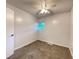 Cozy bedroom featuring neutral carpet, a ceiling fan, and a window letting in natural light at 2981 Judylyn Dr, Decatur, GA 30033