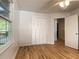 Bright bedroom with hardwood floors, large windows, and an ample closet at 2981 Judylyn Dr, Decatur, GA 30033