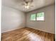 Well-lit bedroom featuring hardwood floors, neutral walls, and a ceiling fan at 2981 Judylyn Dr, Decatur, GA 30033
