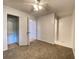 Bright bedroom with a ceiling fan, closet, and access to a bathroom at 2981 Judylyn Dr, Decatur, GA 30033