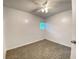 Cozy bedroom featuring neutral carpet, a ceiling fan, and a window letting in natural light at 2981 Judylyn Dr, Decatur, GA 30033