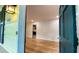Inviting entryway showcasing the beautiful hardwood floors and a glimpse of the modern kitchen at 2981 Judylyn Dr, Decatur, GA 30033