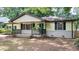 Charming single-story home with a welcoming front porch and well-maintained landscaping at 2981 Judylyn Dr, Decatur, GA 30033