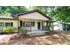 Charming single-story home featuring a cozy front porch and a neatly manicured front yard at 2981 Judylyn Dr, Decatur, GA 30033