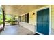 Inviting front porch featuring a blue door, ample light, and pleasant outdoor space for relaxation at 2981 Judylyn Dr, Decatur, GA 30033