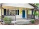 Inviting front porch featuring a blue door, ample light, and pleasant outdoor space for relaxation at 2981 Judylyn Dr, Decatur, GA 30033