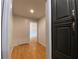 Hallway with wood floors and view into another room at 2981 Judylyn Dr, Decatur, GA 30033