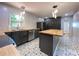 A beautifully remodeled kitchen with dark cabinets and butcher block countertops at 2981 Judylyn Dr, Decatur, GA 30033