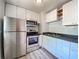 Updated kitchen with stainless steel appliances, white cabinets, and dark countertops at 2981 Judylyn Dr, Decatur, GA 30033