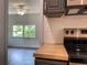 Kitchen view with stainless steel oven, butcher block counters, and a view into an adjacent room at 2981 Judylyn Dr, Decatur, GA 30033