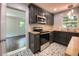 Updated kitchen with dark cabinets, butcher block counters, and stainless steel appliances at 2981 Judylyn Dr, Decatur, GA 30033
