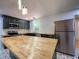 A kitchen with butcher block countertops, pendant lighting, and stainless steel appliances at 2981 Judylyn Dr, Decatur, GA 30033