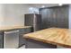 This modern kitchen features a large island, stainless steel appliances and butcher block countertops at 2981 Judylyn Dr, Decatur, GA 30033