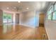Bright living room with hardwood floors, ceiling fan, and access to a deck through glass doors at 2981 Judylyn Dr, Decatur, GA 30033