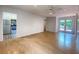 Spacious living room with hardwood floors, ceiling fan, and an adjacent kitchen and access to a deck at 2981 Judylyn Dr, Decatur, GA 30033