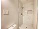 Clean shower with white marble tile and bronze fixtures at 2981 Judylyn Dr, Decatur, GA 30033