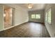 Open sun room with tile flooring, natural lighting and access to an adjacent room at 2981 Judylyn Dr, Decatur, GA 30033