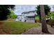A well-manicured lawn leads to a home with an extended patio at 303 Sedgewick Trl, Lawrenceville, GA 30044