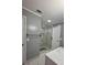 Bathroom featuring white vanity, grey walls, and a tiled shower at 303 Sedgewick Trl, Lawrenceville, GA 30044