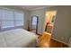 Bedroom featuring hardwood floors and ample natural light at 303 Sedgewick Trl, Lawrenceville, GA 30044