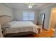 Bedroom featuring hardwood floors and ample natural light at 303 Sedgewick Trl, Lawrenceville, GA 30044