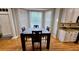 Breakfast nook with large bay window, hardwood floors, and neutral paint at 303 Sedgewick Trl, Lawrenceville, GA 30044