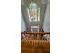 Bright foyer with staircase and large window with a view of the front yard at 303 Sedgewick Trl, Lawrenceville, GA 30044