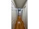 Hallway featuring hardwood floors and multiple closets at 303 Sedgewick Trl, Lawrenceville, GA 30044