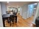 Open concept kitchen and breakfast nook with breakfast bar, stainless steel appliances, and neutral paint at 303 Sedgewick Trl, Lawrenceville, GA 30044