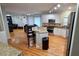 Bright, open kitchen with stainless steel appliances, granite counters, and a breakfast bar for casual dining at 303 Sedgewick Trl, Lawrenceville, GA 30044