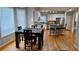 Kitchen and breakfast nook with hardwood floors and neutral wall paint at 303 Sedgewick Trl, Lawrenceville, GA 30044
