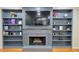Fireplace flanked by bookcases and mounted TV at 303 Sedgewick Trl, Lawrenceville, GA 30044