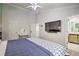 Bright bedroom featuring high ceilings, a modern ceiling fan, and access to an en-suite bathroom at 3285 Long Iron Pl, Lawrenceville, GA 30044