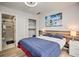 Comfortable bedroom featuring a queen-size bed, wood paneling, and ensuite bathroom with shower at 3285 Long Iron Pl, Lawrenceville, GA 30044