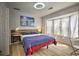 Bright bedroom with a window providing natural light, wood floors, and modern decor at 3285 Long Iron Pl, Lawrenceville, GA 30044
