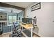 Functional office space with modern setup, wood-look floors, and neutral paint overlooking living area at 3285 Long Iron Pl, Lawrenceville, GA 30044