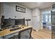 Functional office space with modern setup, wood-look floors, and neutral paint at 3285 Long Iron Pl, Lawrenceville, GA 30044