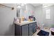 Bathroom featuring a single sink vanity with decorative accents and a separate toilet area at 101 Olympic Ct, Fayetteville, GA 30214